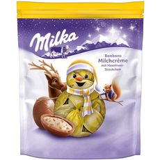 MILKA Bonbons de Noël au chocolat au lait fourrés crème confiseur et noisettes 86g